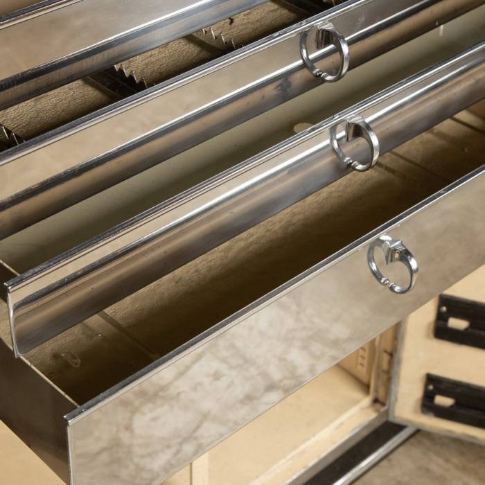 Unusual medical table and cabinet in polished metal from BAISCH. 