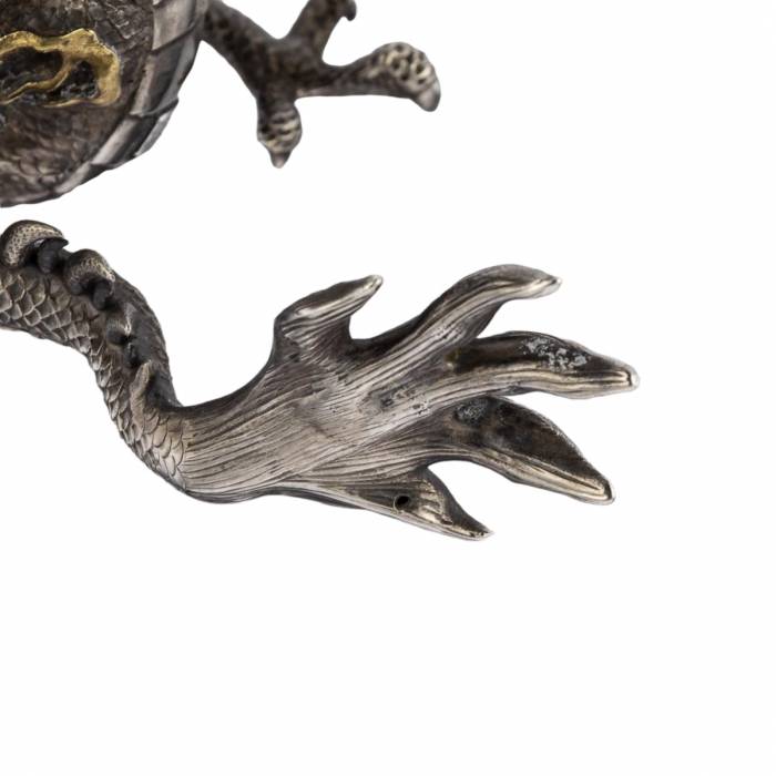 Japanese silver candelabra in the form of a dragon from the Meiji period of the 19th century. 