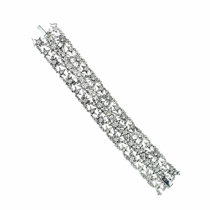 Wide gold bangle with diamonds. 