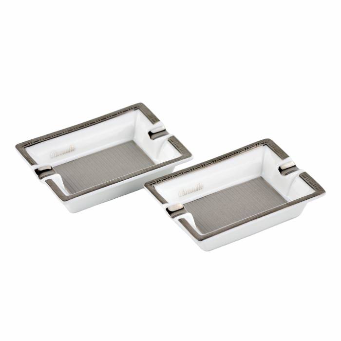 Two small, personalized, silver-plated Christofle porcelain ashtrays. 