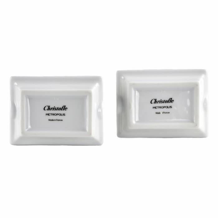 Two small, personalized, silver-plated Christofle porcelain ashtrays. 