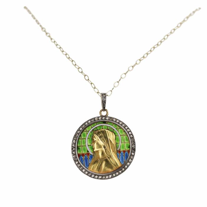 An elegant gold pendant on a chain with Our Lady on stained glass enamel, in an antique case. 