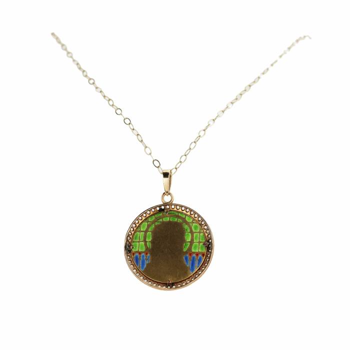 An elegant gold pendant on a chain with Our Lady on stained glass enamel, in an antique case. 