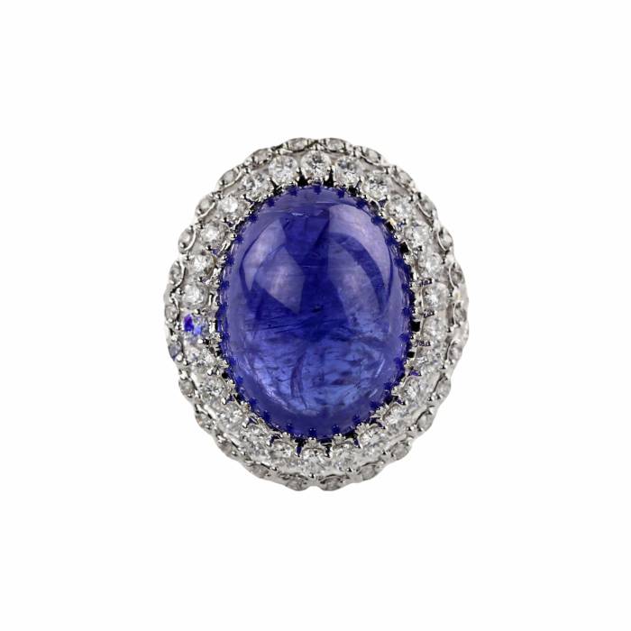 Ring in 18K white gold with tanzanite, cabochon cut, and loose diamonds. 