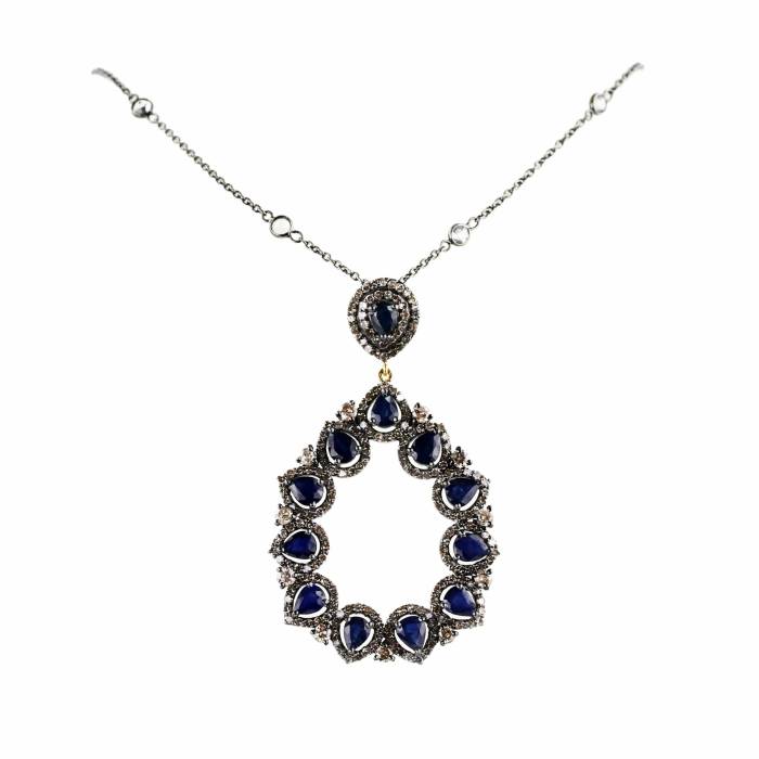 Set of earrings, pendant with sapphires and diamonds on silver and gold. 