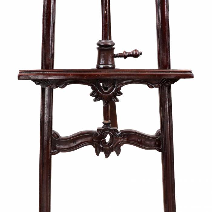 Wooden easel in neo-baroque style. 