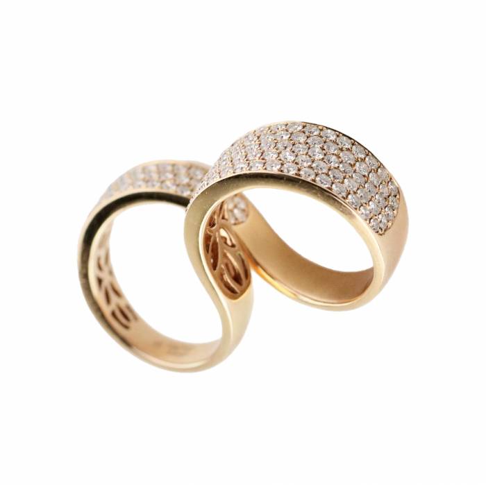 Fashionable rose gold two-finger ring with diamonds. 