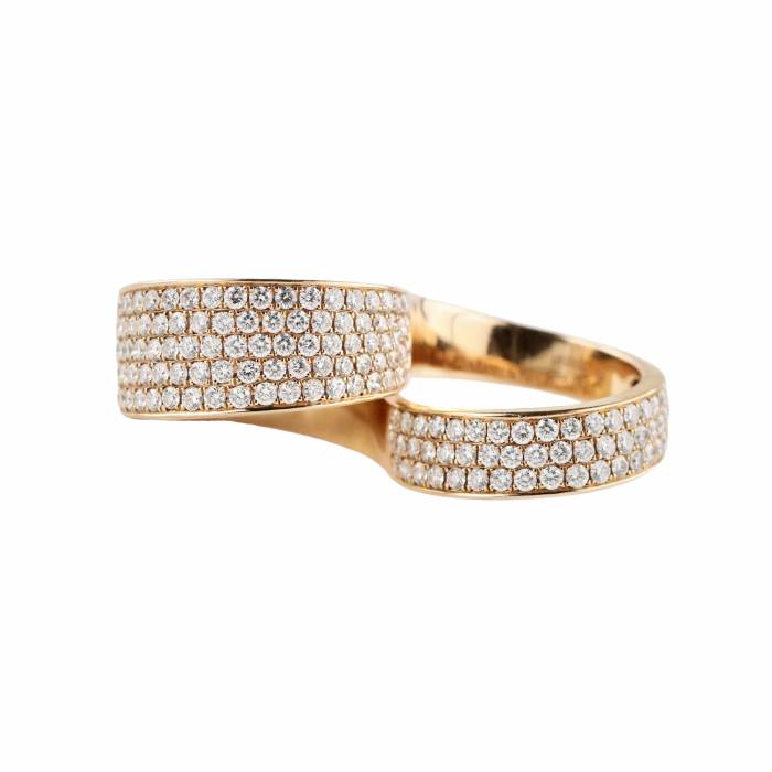 Fashionable rose gold two-finger ring with diamonds. 