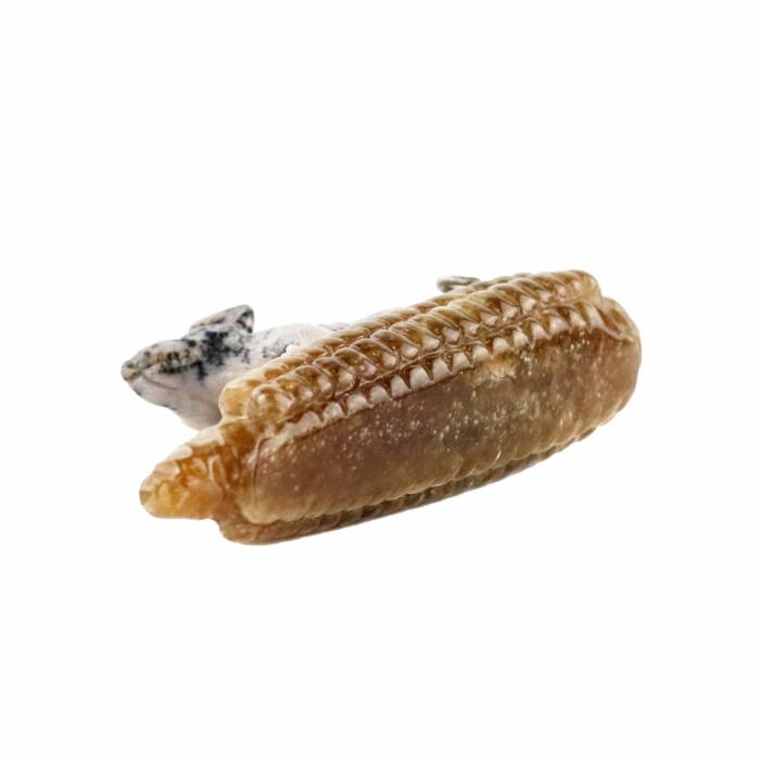 Stone-cutting miniature Mouse on a corn. 