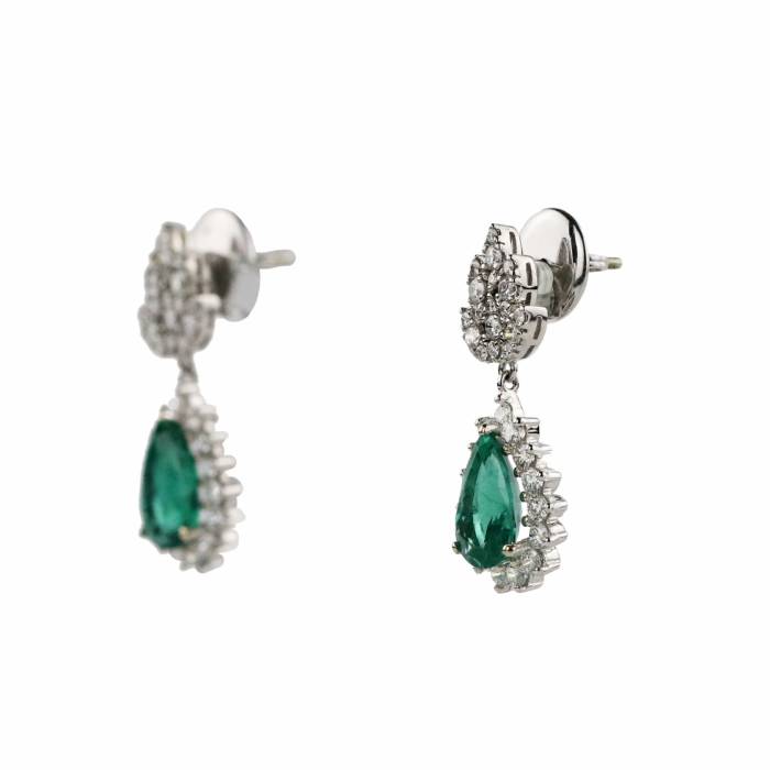 Gold earrings with emeralds and diamonds. 