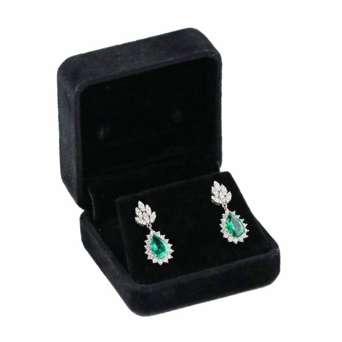 Gold earrings with emeralds and diamonds. 