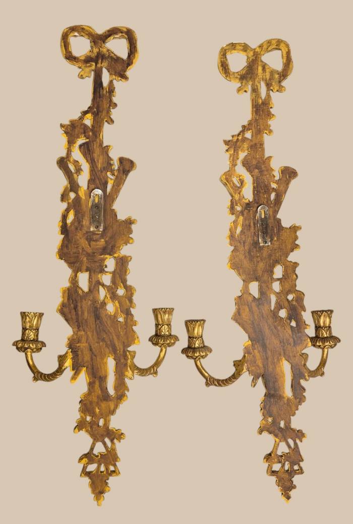 Pair of two-light gilded wood wall sconces in the Louis XVI style, 19th century