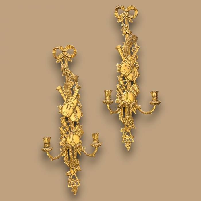 Pair of two-light gilded wood wall sconces in the Louis XVI style, 19th century