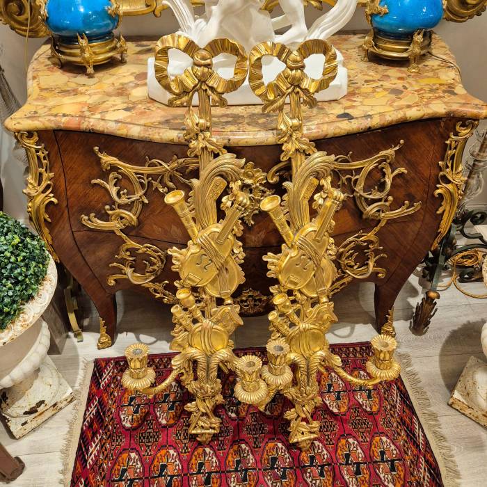 Pair of two-light gilded wood wall sconces in the Louis XVI style, 19th century
