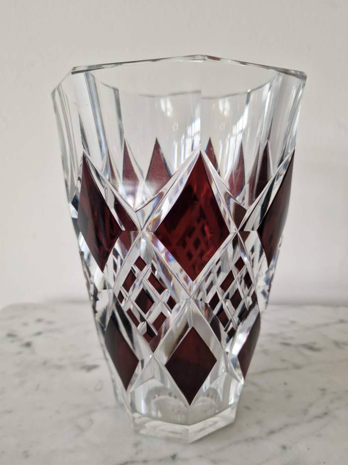 Bohemian crystal vase with bronze puti