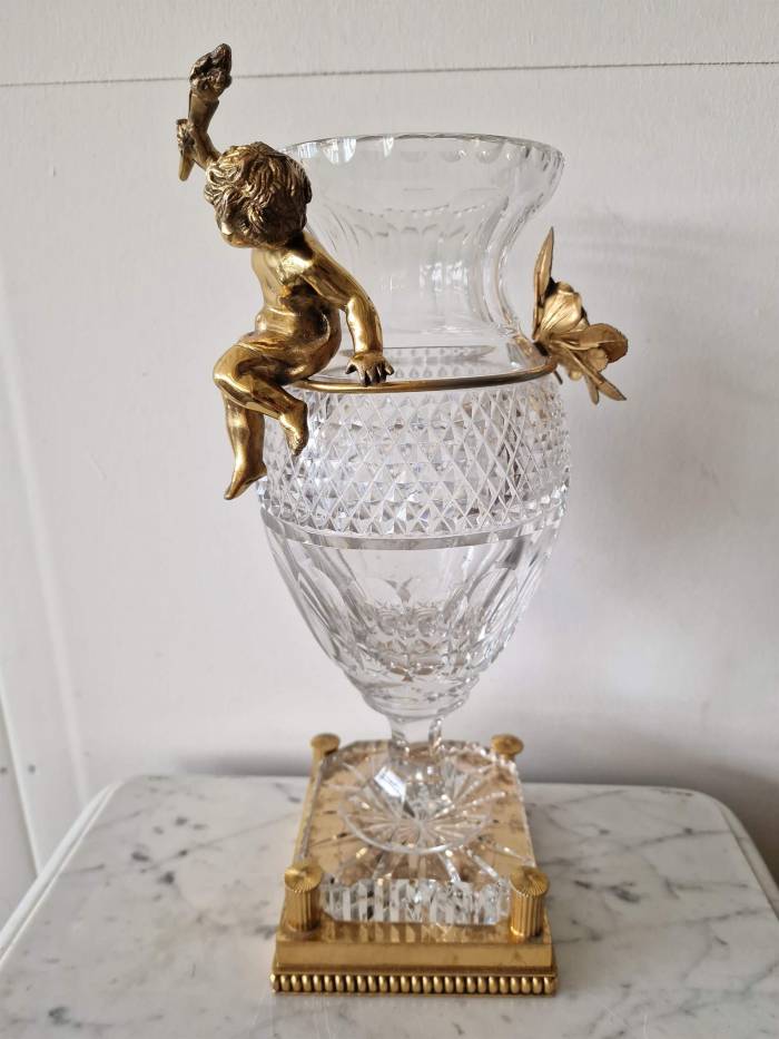 Bohemian crystal vase with bronze puti