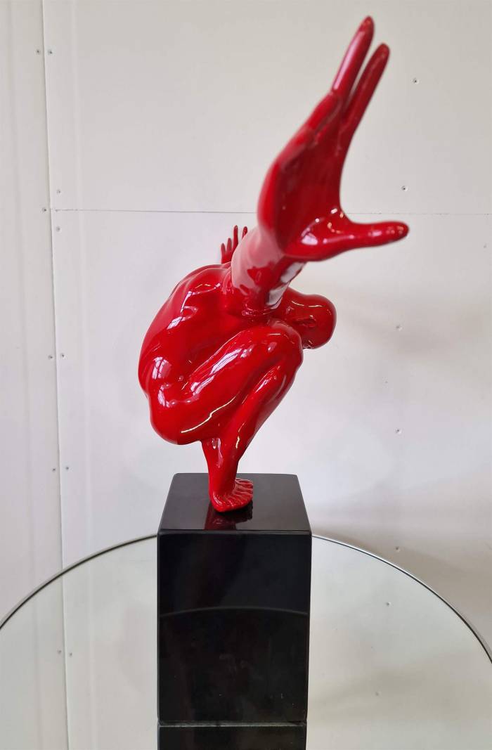 An elegant figure on a stone base