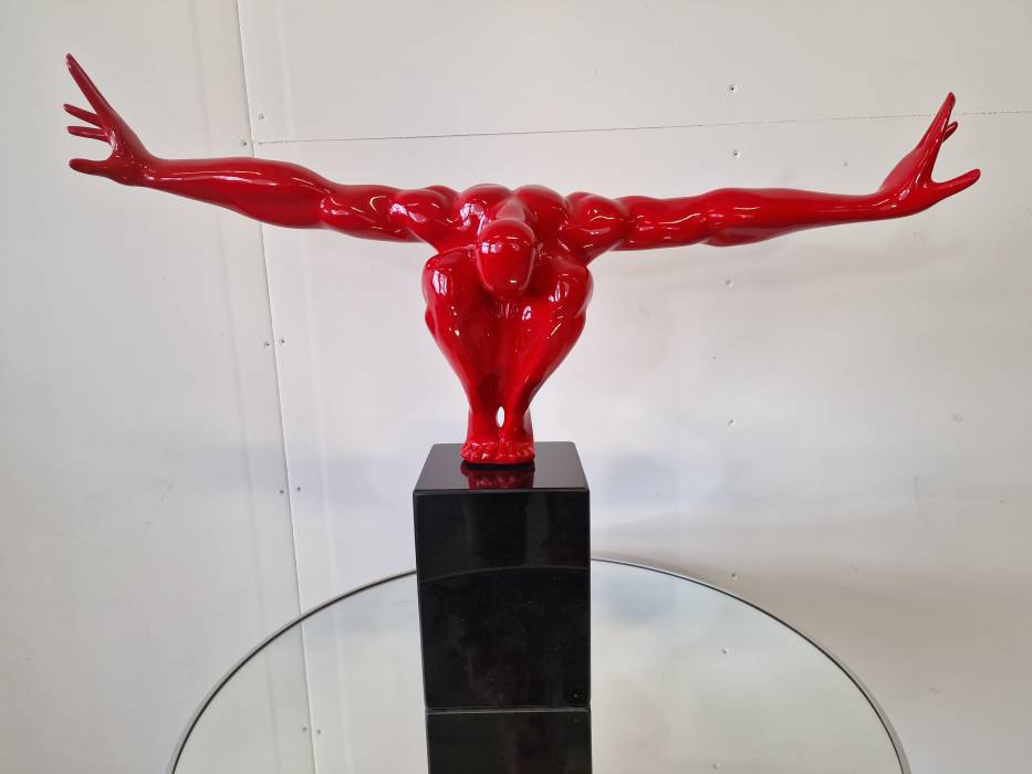 An elegant figure on a stone base