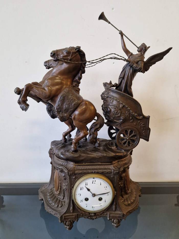 Clock with horse figures