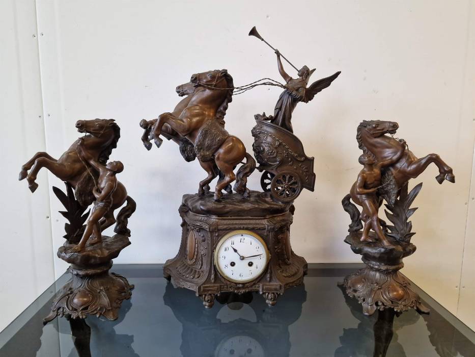 Clock with horse figures