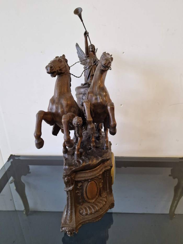 Clock with horse figures