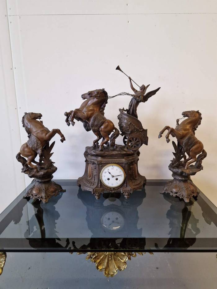 Clock with horse figures