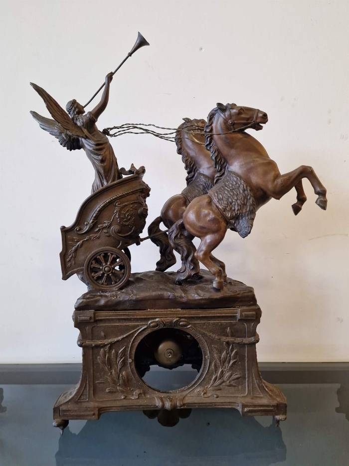 Clock with horse figures