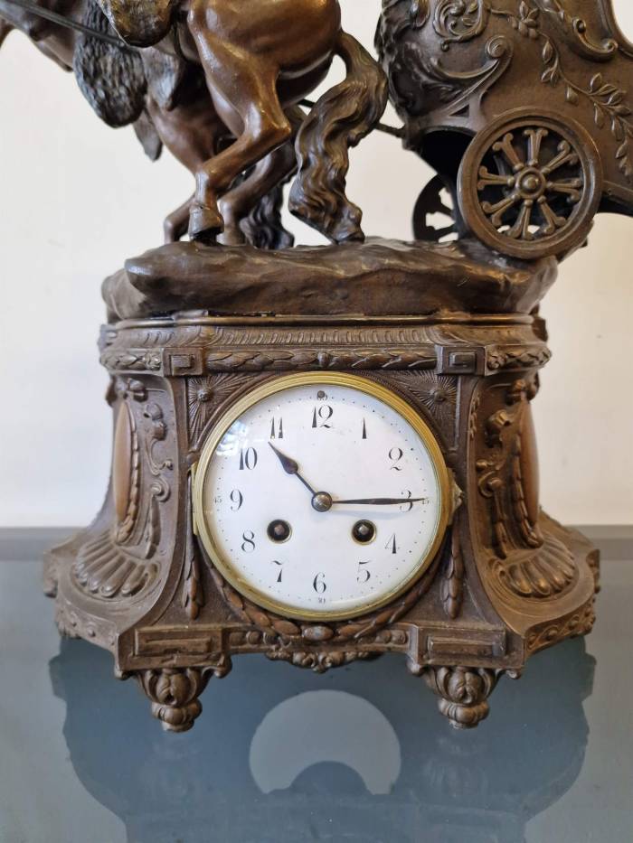 Clock with horse figures