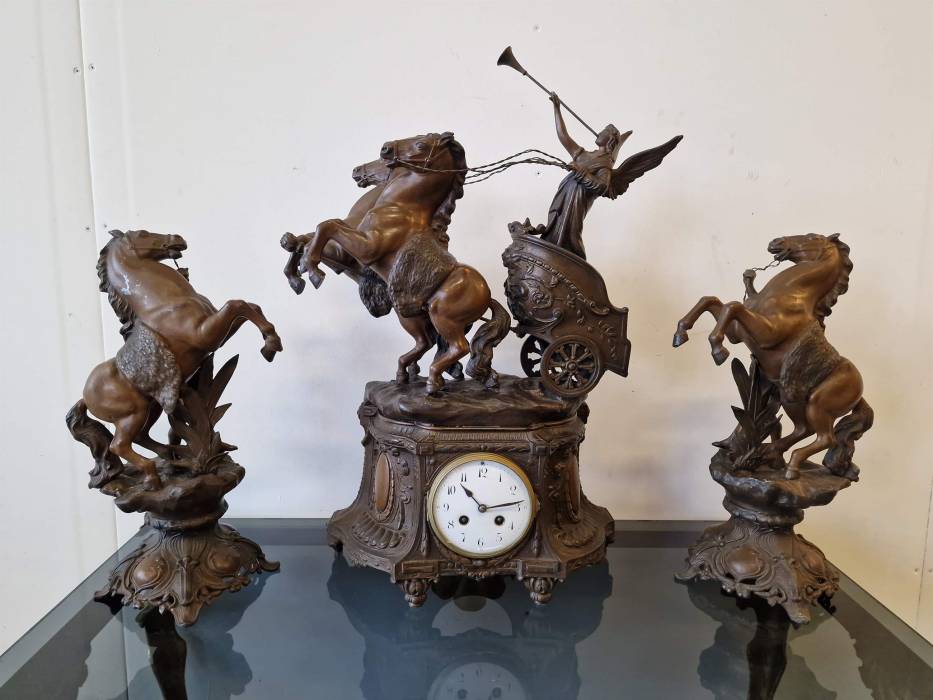 Clock with horse figures