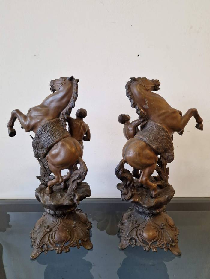 Clock with horse figures