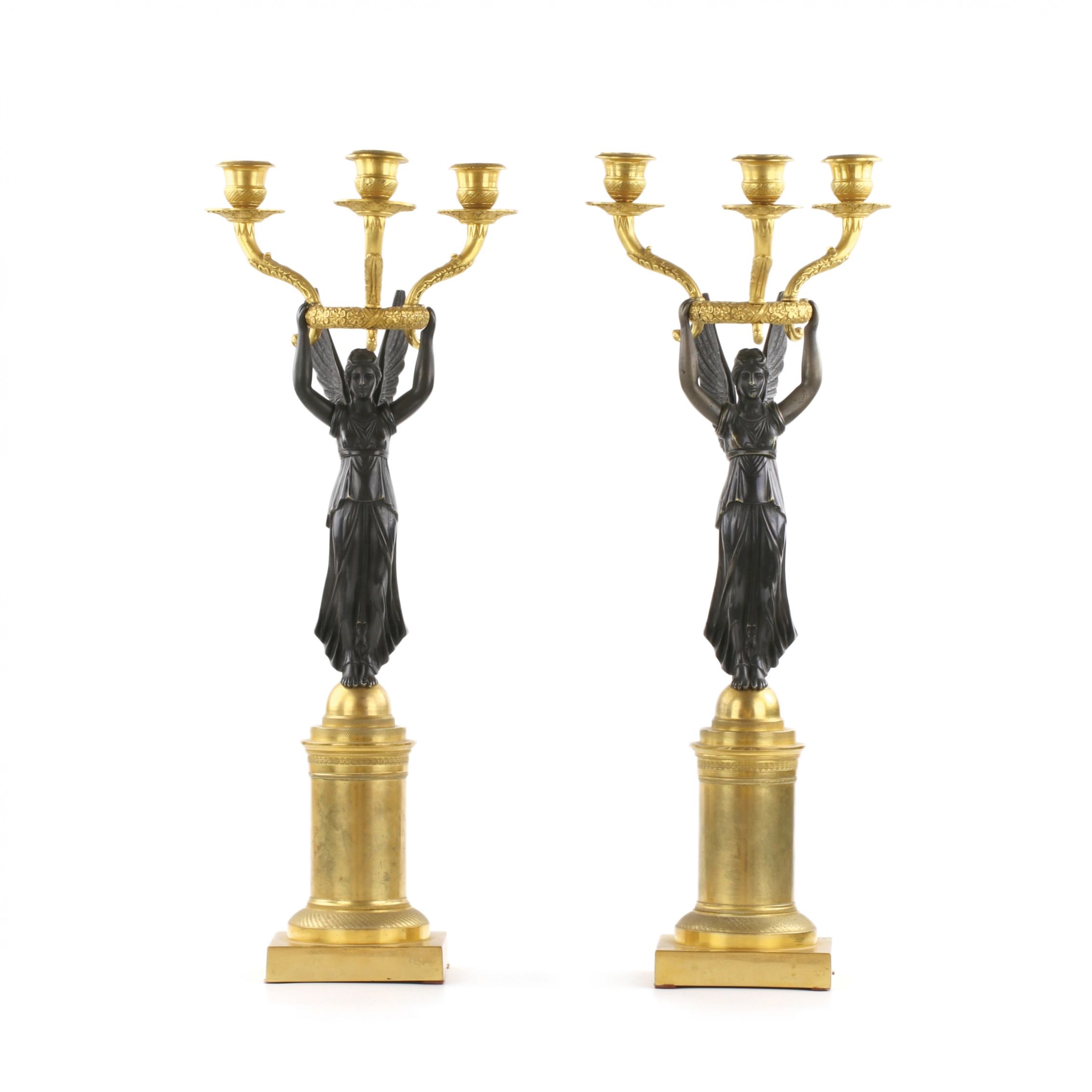 A-pair-of-bronze-candlesticks-in-Empire-style