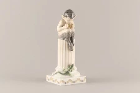 Figurine "Faun playing on a column". Royal Copenhagen