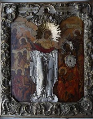 An ancient icon of the Mother of God "Joy of All Who Sorrow" in a baroque silver setting. Russia, XVIII century. 