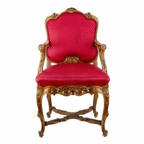 Magnificent, carved armchair in the Rococo style of the 19th and 20th centuries. 
