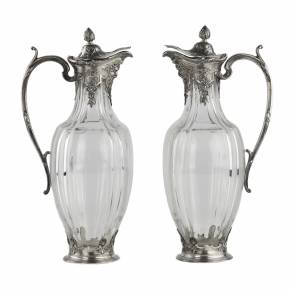 A pair of Regency style crystal jugs in silver from CHRISTOFLE. 