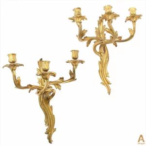 A pair of gilt bronze sconces