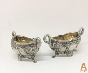 A pair of Empire style silver saltcellars Swans
