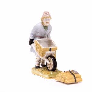 "Man with wheelbarrow of firewood"