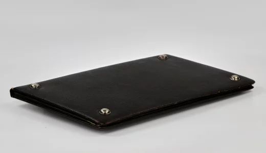 Leather portfolio with silver overlay. Russia, 1908-1917.
