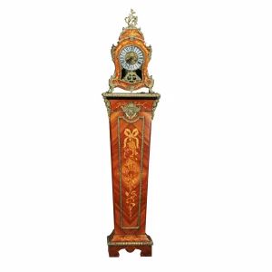 Clock on a pedestal in the Louis XVI style.