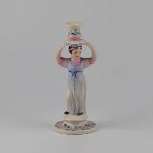 Porcelain candlestick-figure Russian peasant woman.
