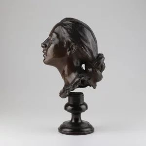 Bronze bust of a woman.