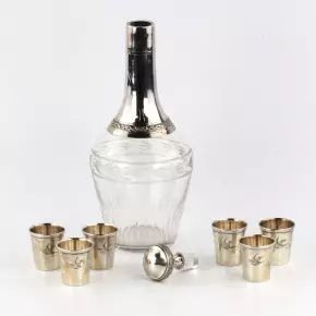 A set of glasses with a carafe