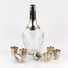 A set of glasses with a carafe