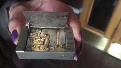 Exquisite erotic, gilded and silvered automatic matchbox. ----