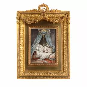 Playful miniature  in a gold frame. 