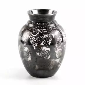 Decorative glass vase with cut-out silver decor. 