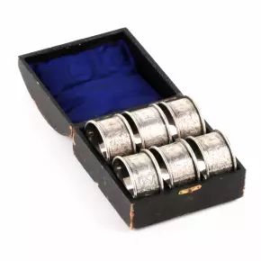 Six English silver napkin rings, in an original case. 