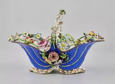 Porcelain vase-basket with molded flowers. 