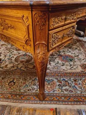 Regency style office table, richly carved. 